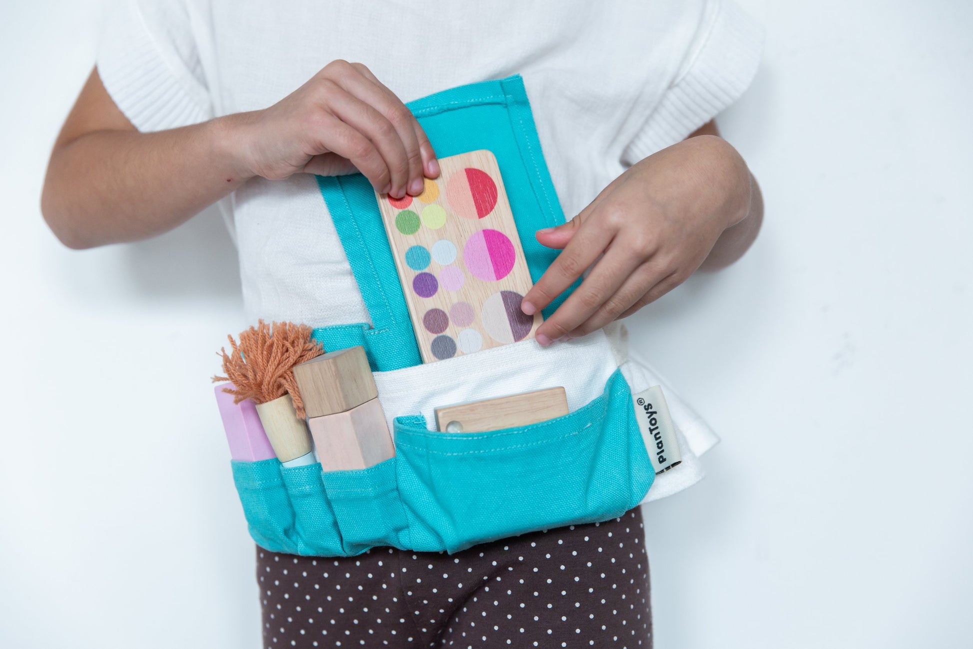 Girl wearing and opening makeup set waist bag