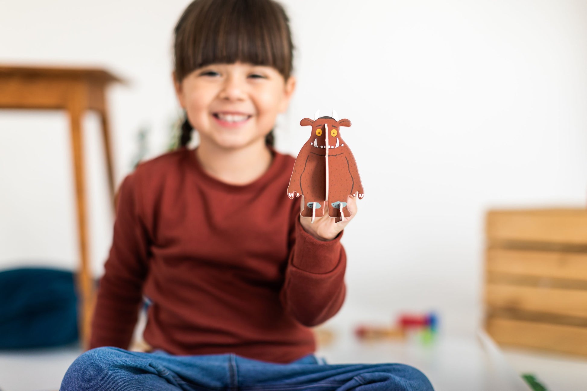 Girl holding Gruffalo pop out character