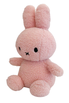 Side view of pink teddy Miffy the rabbit