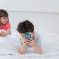 Children role playing with wooden phone
