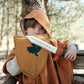 Boy holding shield and sword dress up front view