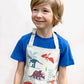 Boy wearing Dinosaur Friends apron