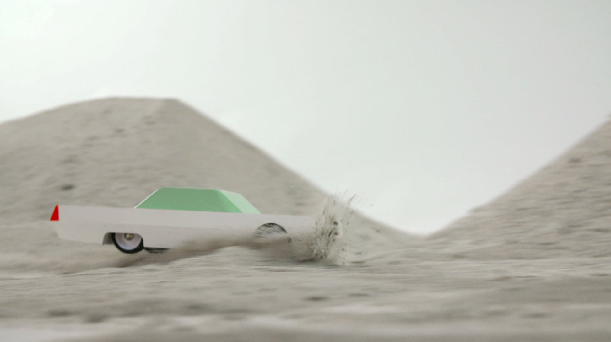 Whitebeast racing across sand