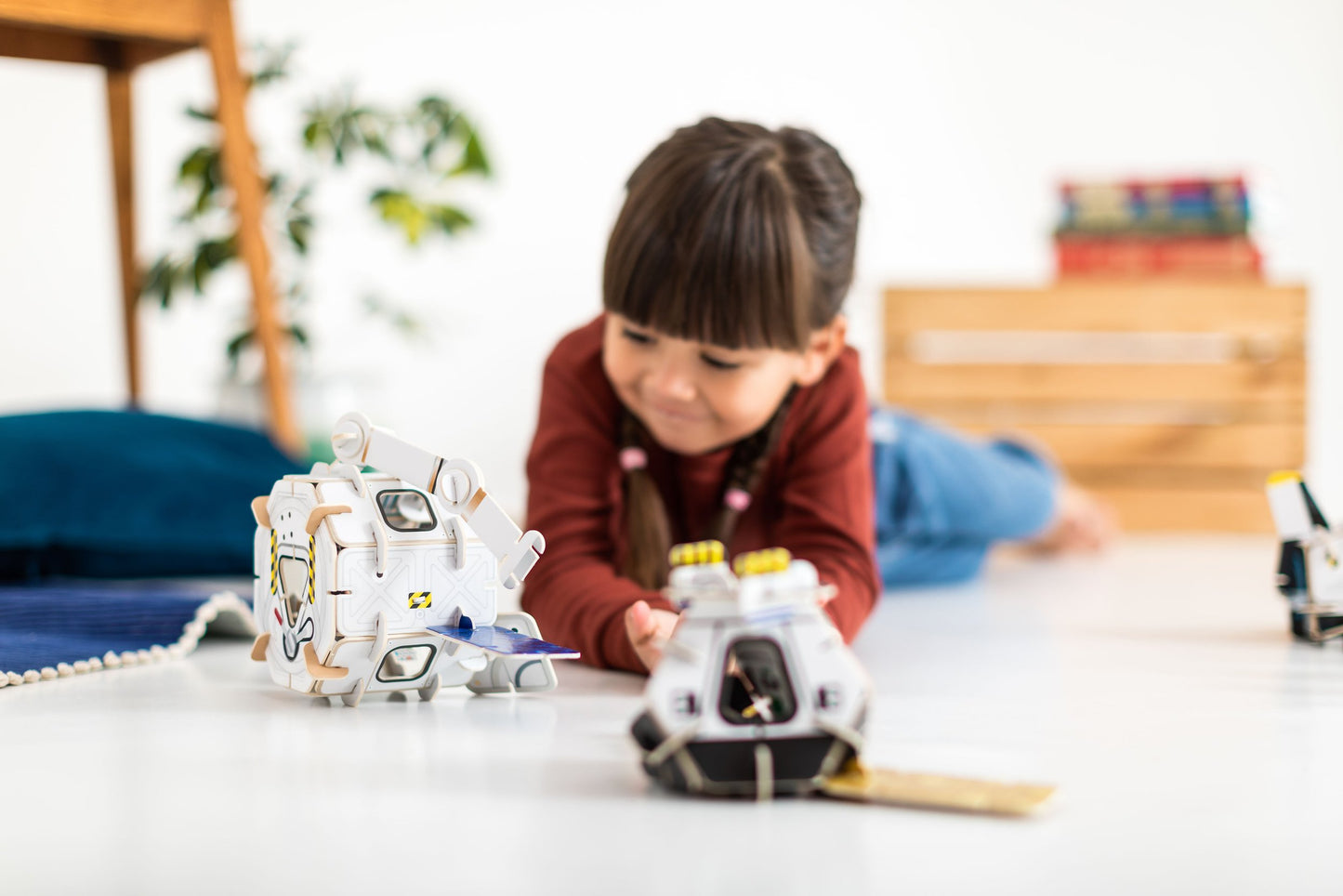 Girl playing with Space Station Playpress Set