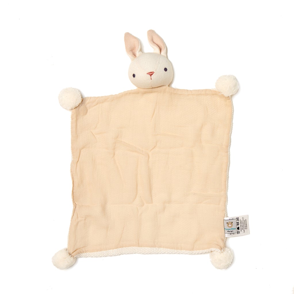 Cream bunny comforter lying flat